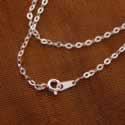 Flattened oval silver link chain.
